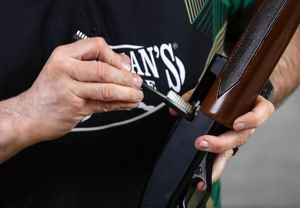 Use a nylon brush to clean the inside of the receiver.