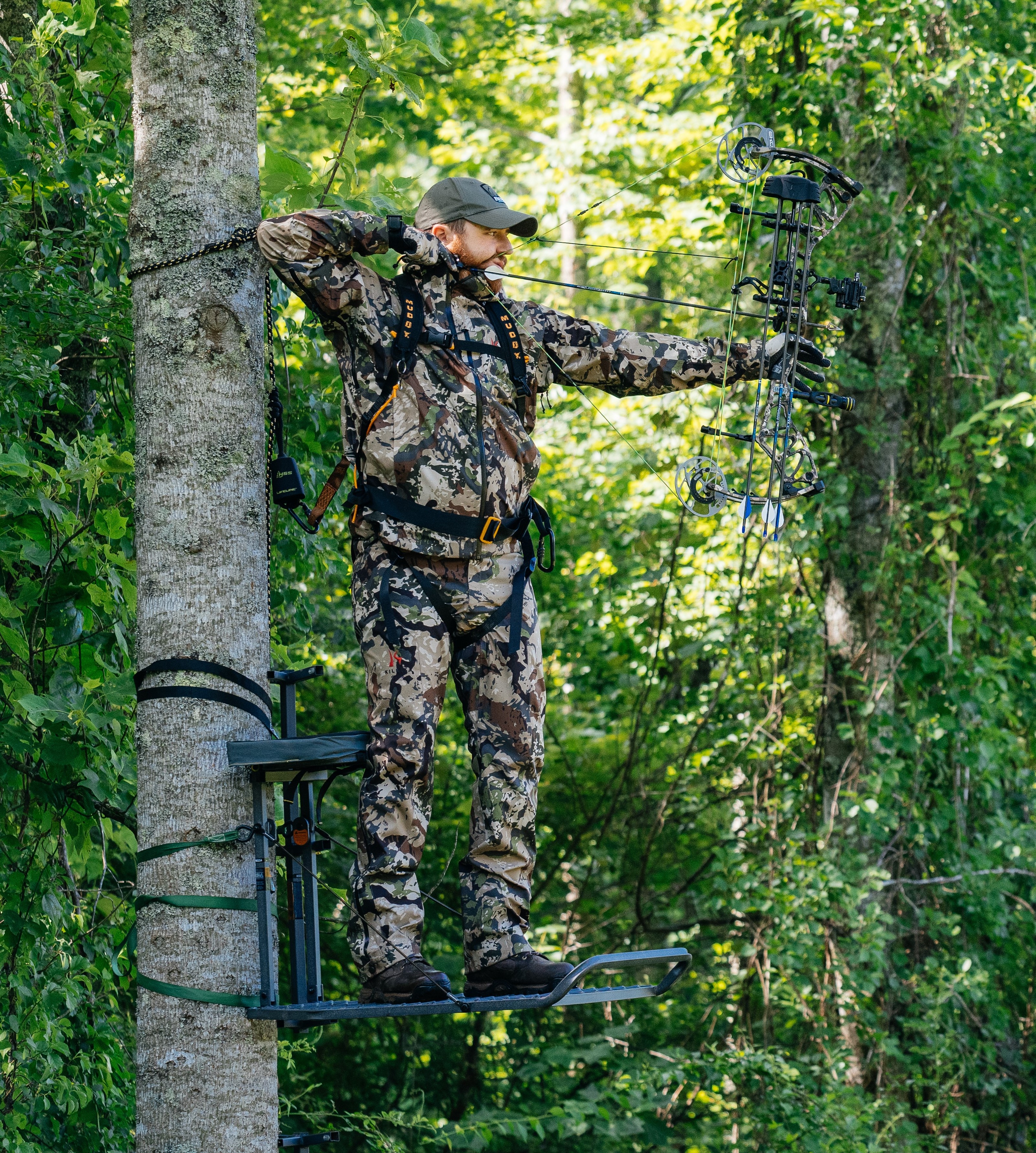 Bowhunter in a hang-on treestand